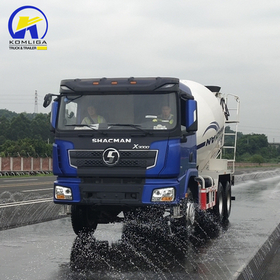 Shacman 6X4 camion mélangeur de béton avec haute performance et remontage hydraulique à bascule ventrale