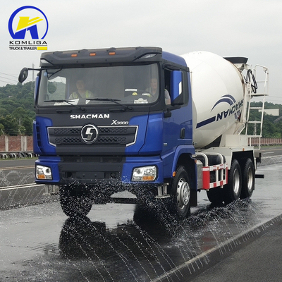 Shacman 6X4 camion mélangeur de béton avec haute performance et remontage hydraulique à bascule ventrale