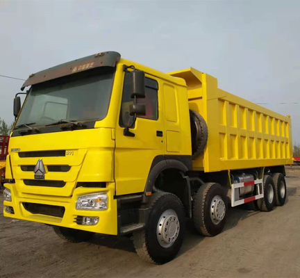 Sinotruk HOWO 8X4 371HP camion à ordures jaune d'occasion avec transmission manuelle